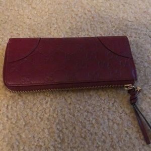 Gucci leather wallet.